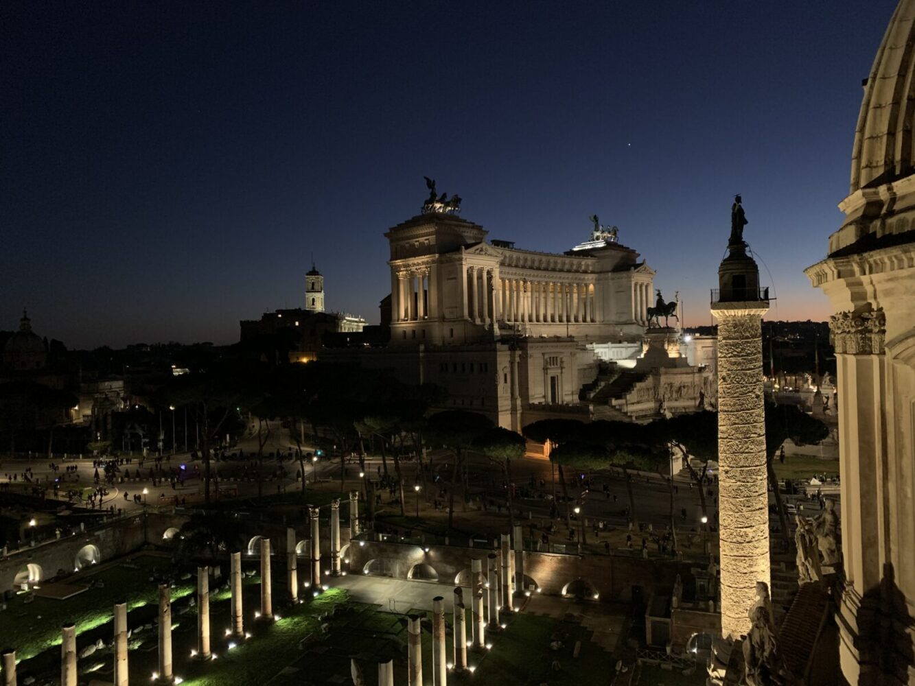 Italy Rome at night Altare della Patria building with Roman Forum ruins in front & Trajan's Column beside Leon Hulme