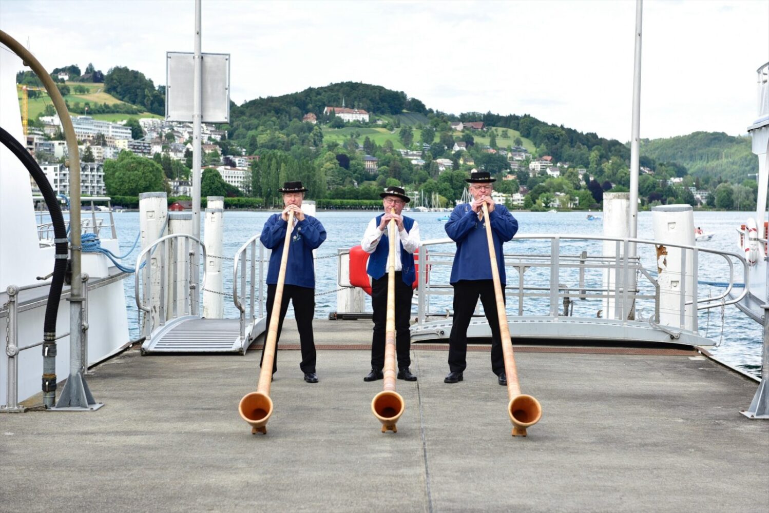 Switzerland Traditional Swiss alphorns on boat crossing Lake Lucerne sloane lorenzo