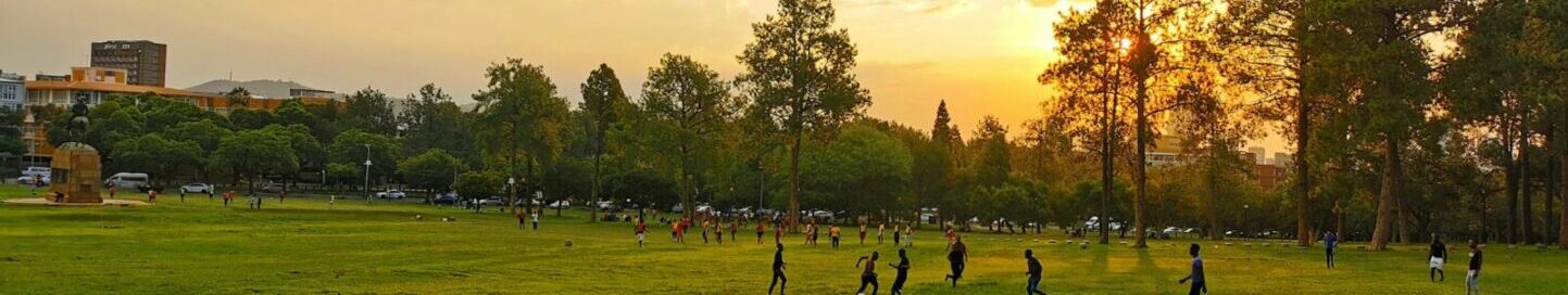 Playing soccer in the park at sunset in Pretoria South Africa Sipho Ndebele