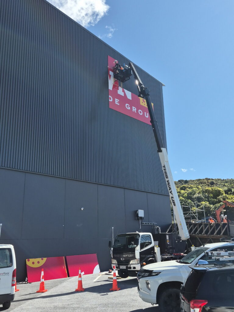 Outside signage going up on Crown's new Warehouse, Porirua, Wellington Sept 2026