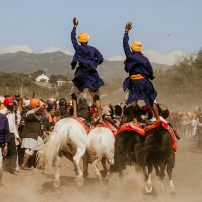 Punjab Nihang Sikhs horse riding acrobatics during Holla Mohalla festival in Anandpur Sahib, Punjab Chander Mohan